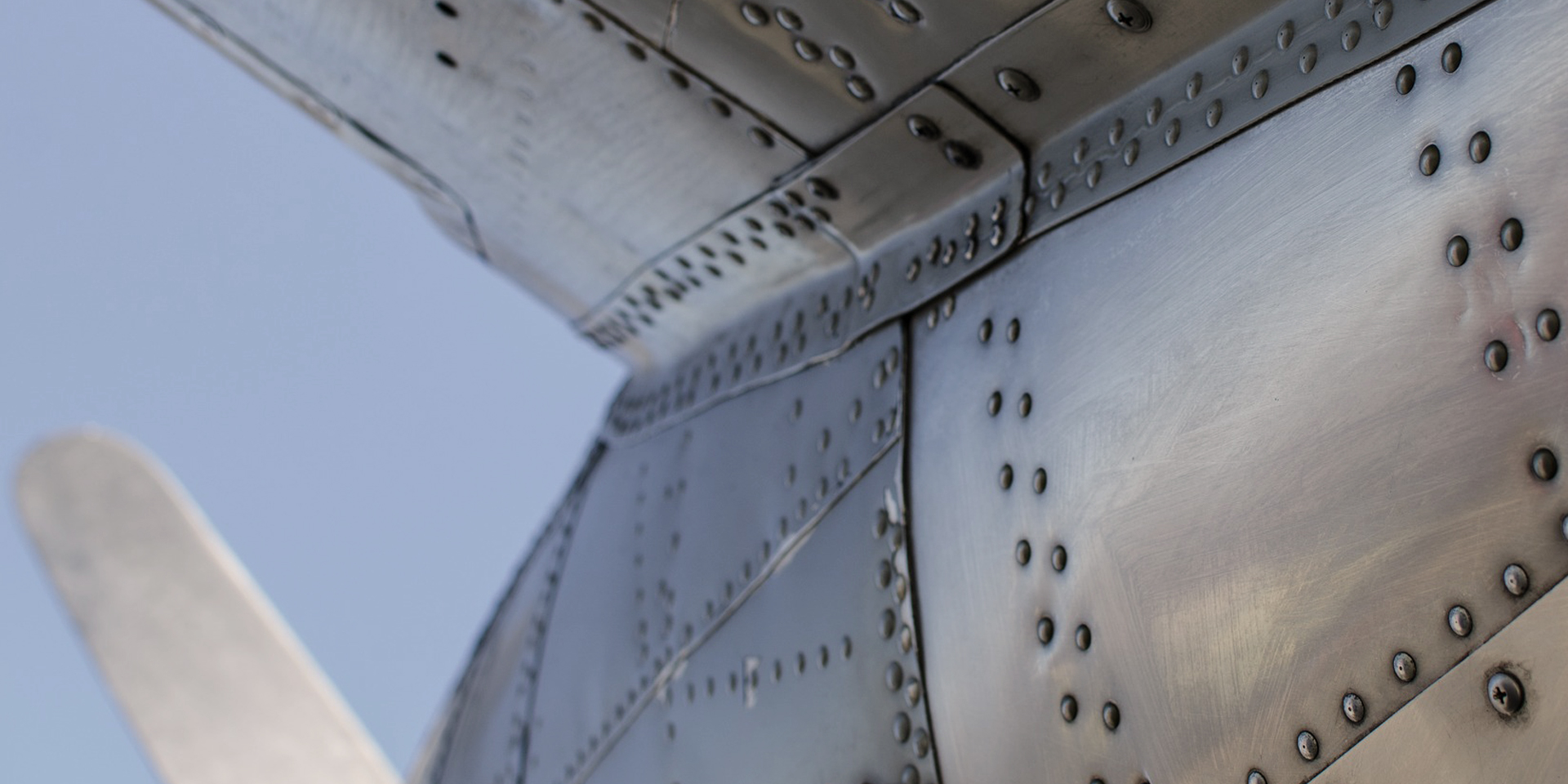 Close up shot of rivets on side of a plane