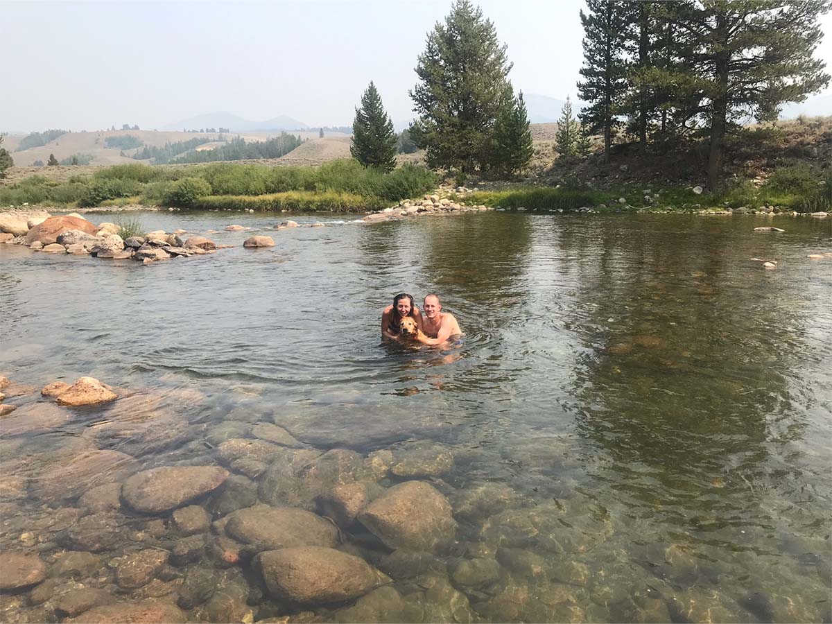 Nikki, Ryan and Cooper taking a dip in the river