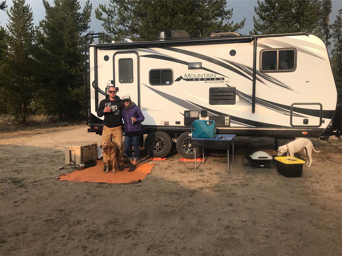 Nikki, Ryan and Cooper in front of camper