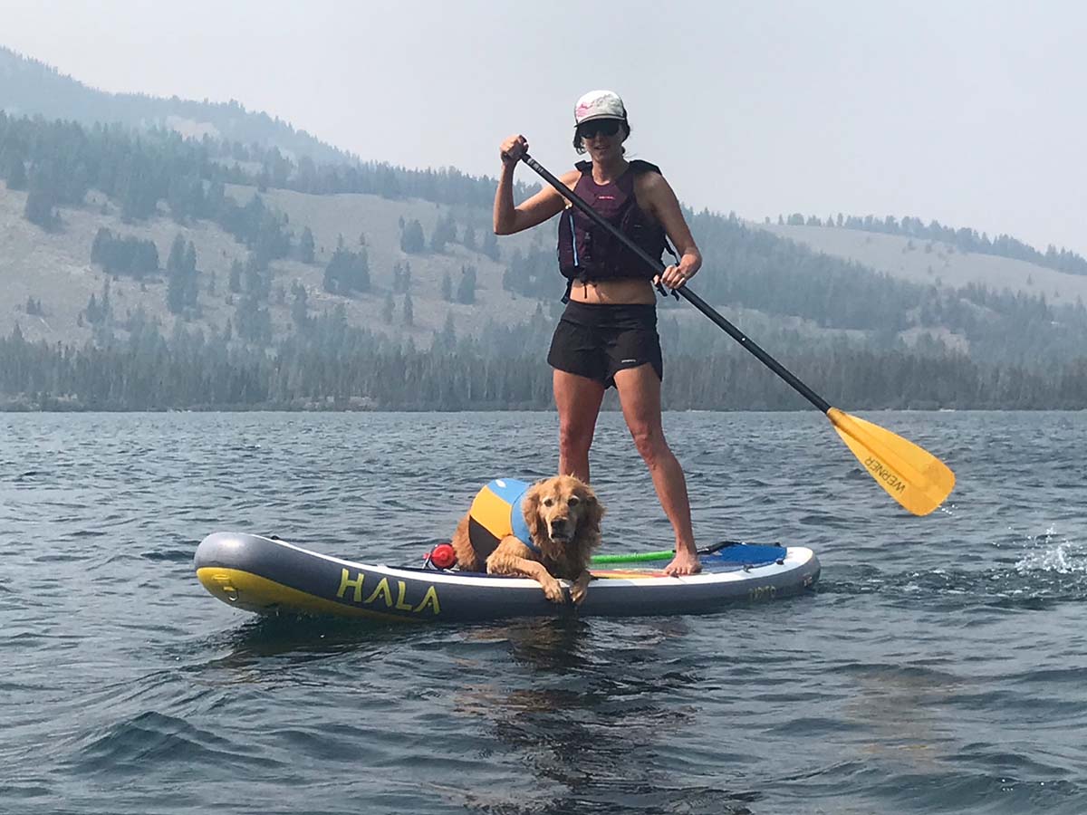 Nikki and Cooper stand up paddle boarding