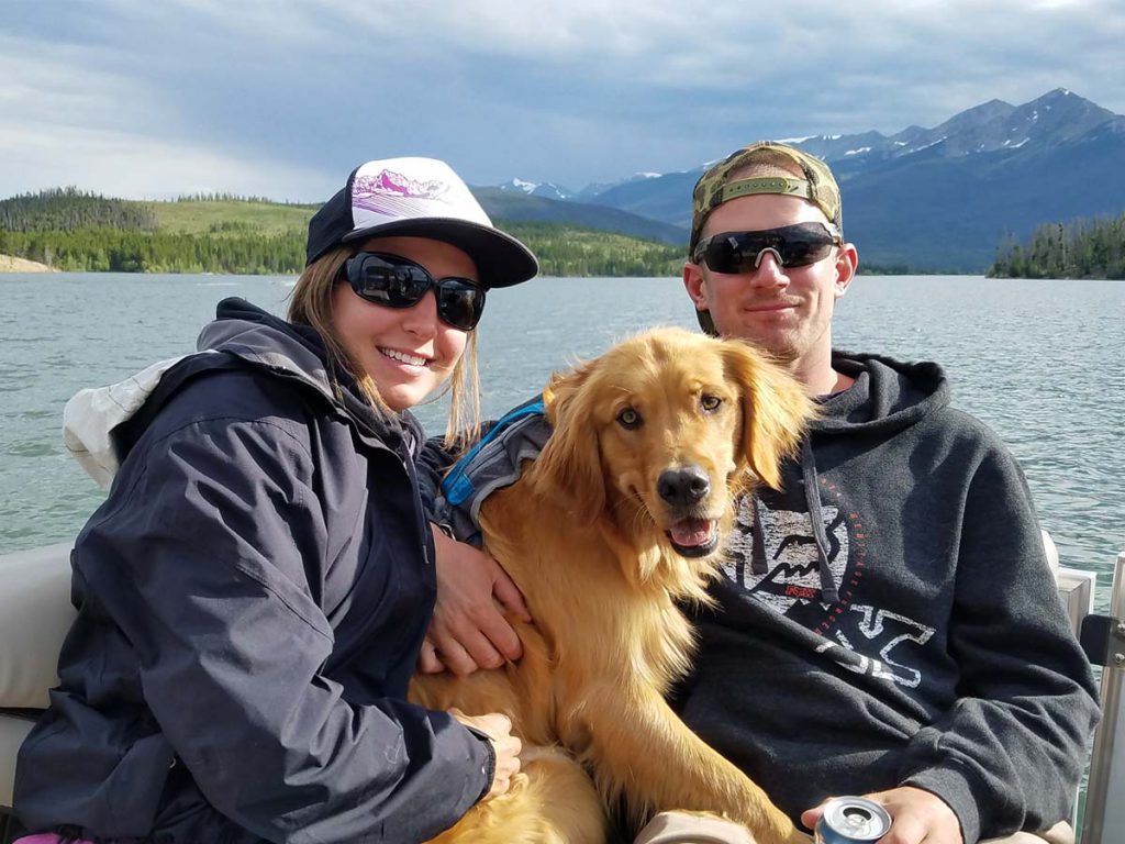 Nikki and Ryan Harper with Cooper on boat